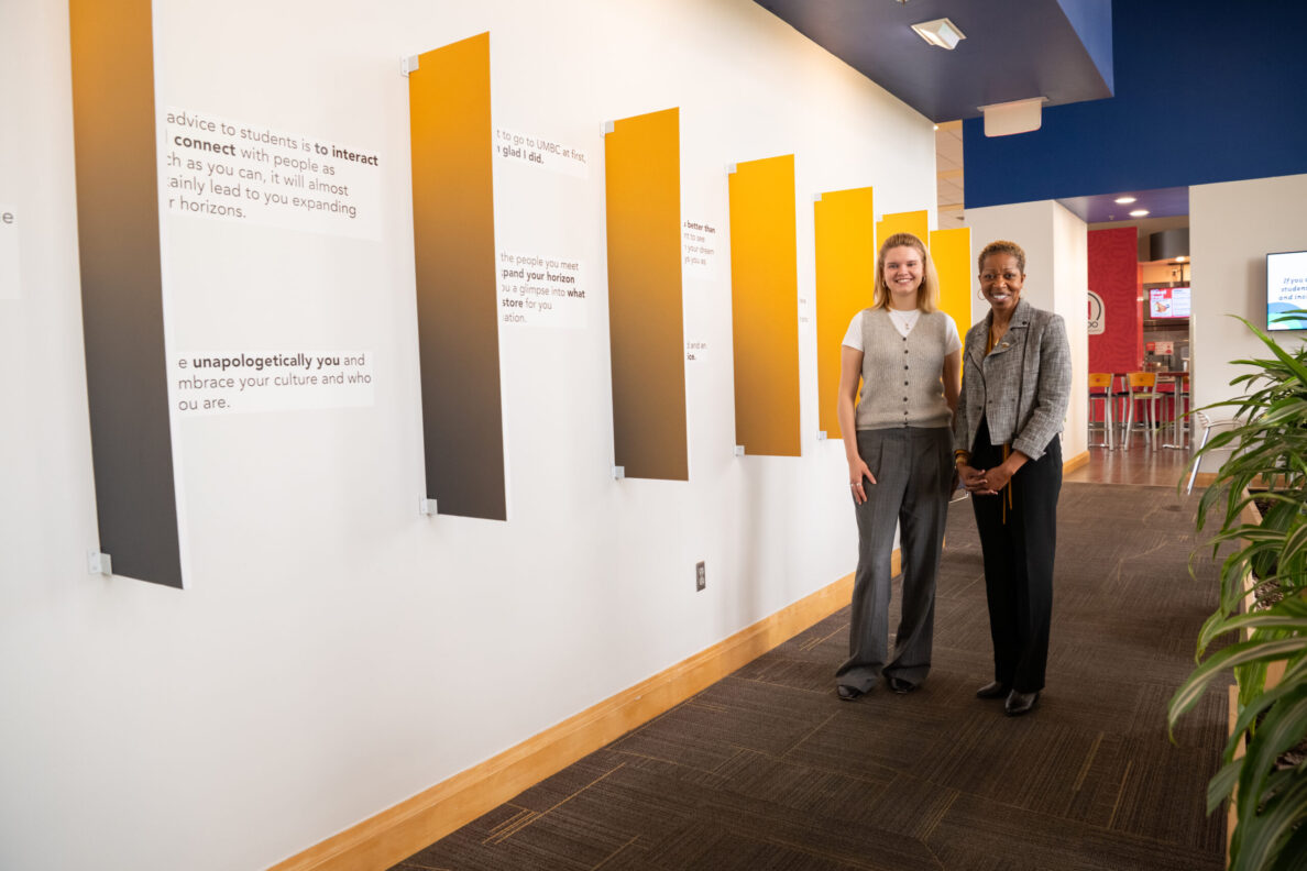 HCC MS student discusses art installation with UMBC president